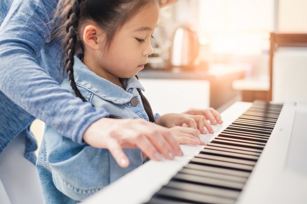 girl playing piano